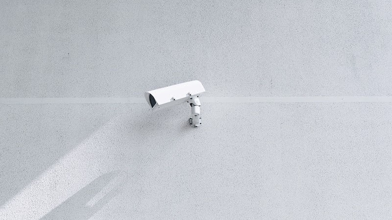 Security camera on a white wall